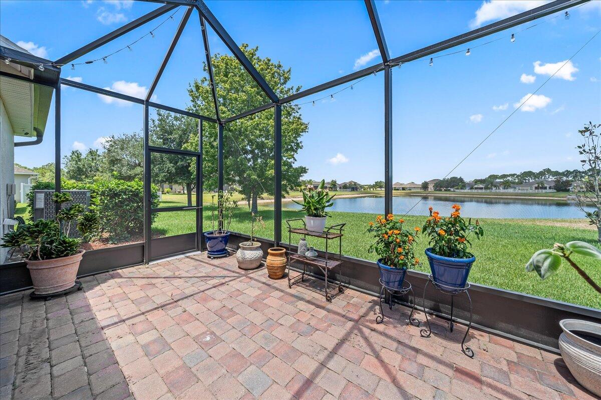 337 Abernathy Circle Palm Bay, FL 32909 - Photo 17 of 51 a patio with glass top table and chairs