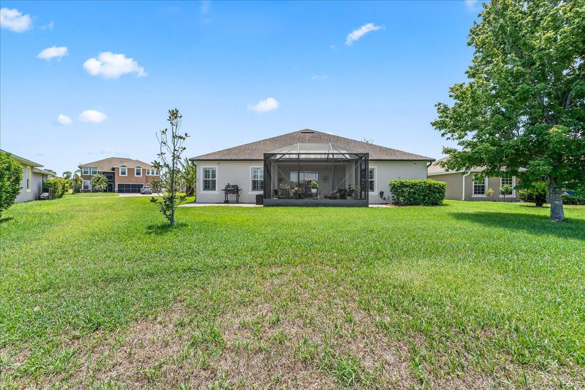 337 Abernathy Circle Palm Bay, FL 32909 - Photo 19 of 51 a front view of a house with garden
