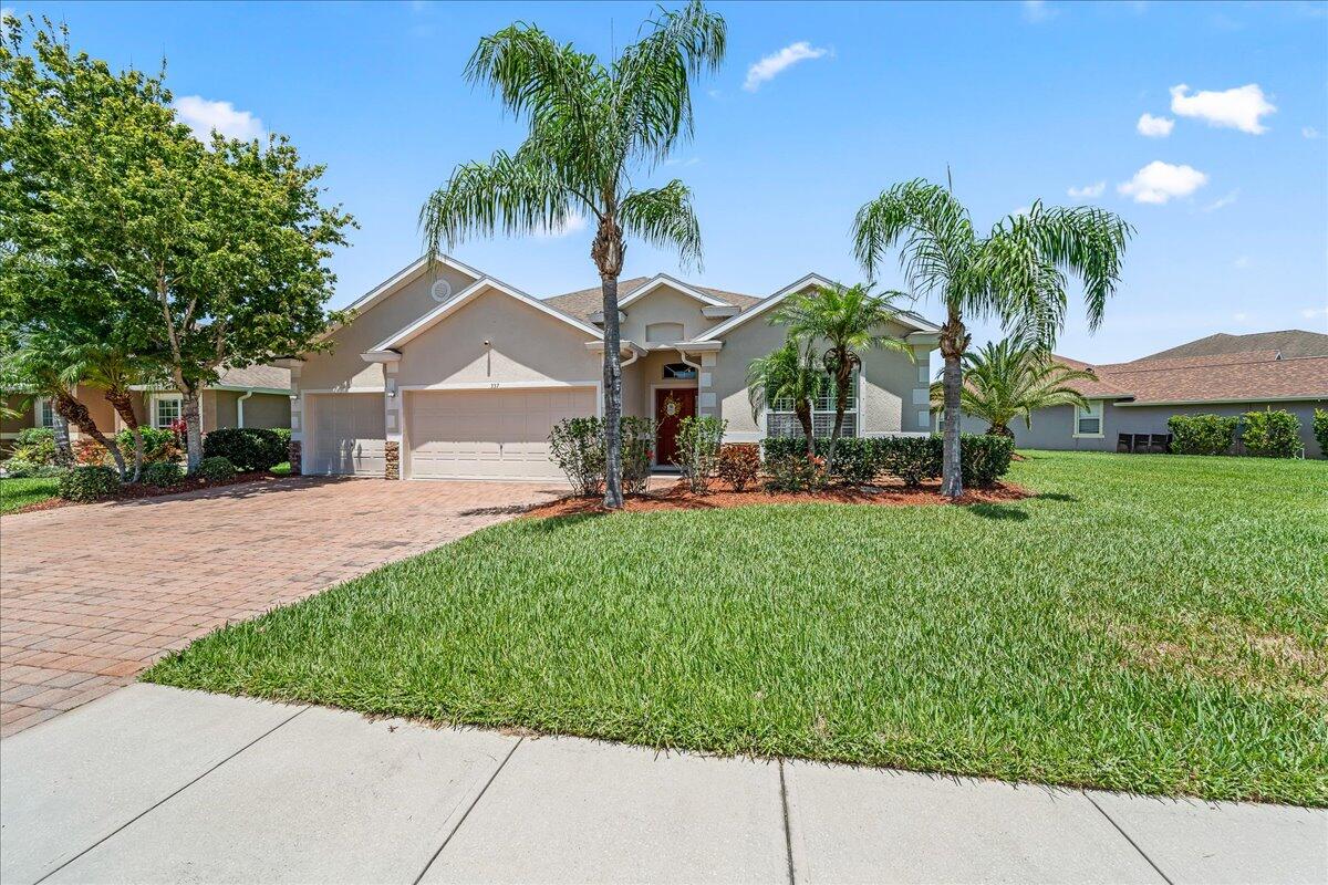 337 Abernathy Circle Palm Bay, FL 32909 - Photo 2 of 51 a front view of house with yard and green space