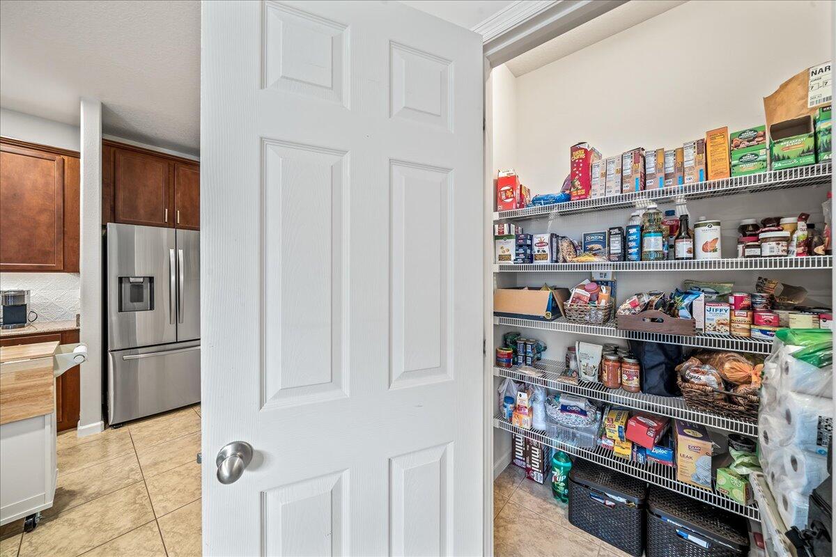 337 Abernathy Circle Palm Bay, FL 32909 - Photo 24 of 51 a room with fridge and a shelf