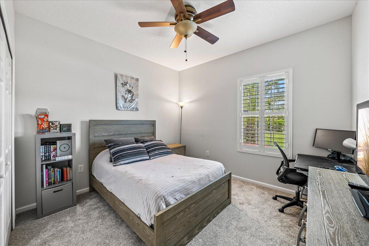 337 Abernathy Circle Palm Bay, FL 32909 - Photo 32 of 51 a bedroom with a bed and a window