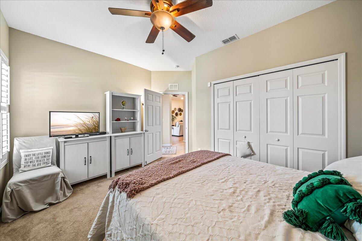 337 Abernathy Circle Palm Bay, FL 32909 - Photo 37 of 51 a bedroom with a bed and a flat screen tv