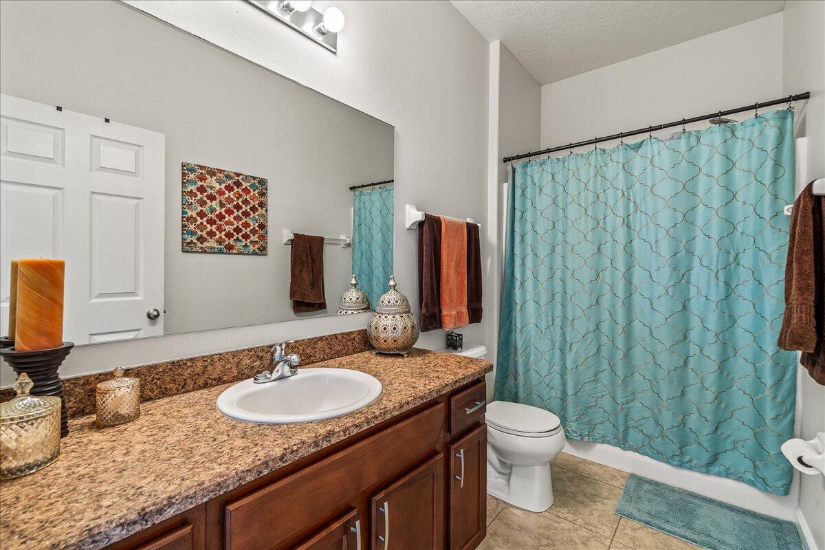 337 Abernathy Circle Palm Bay, FL 32909 - Photo 38 of 51 a bathroom with a granite countertop sink and a mirror