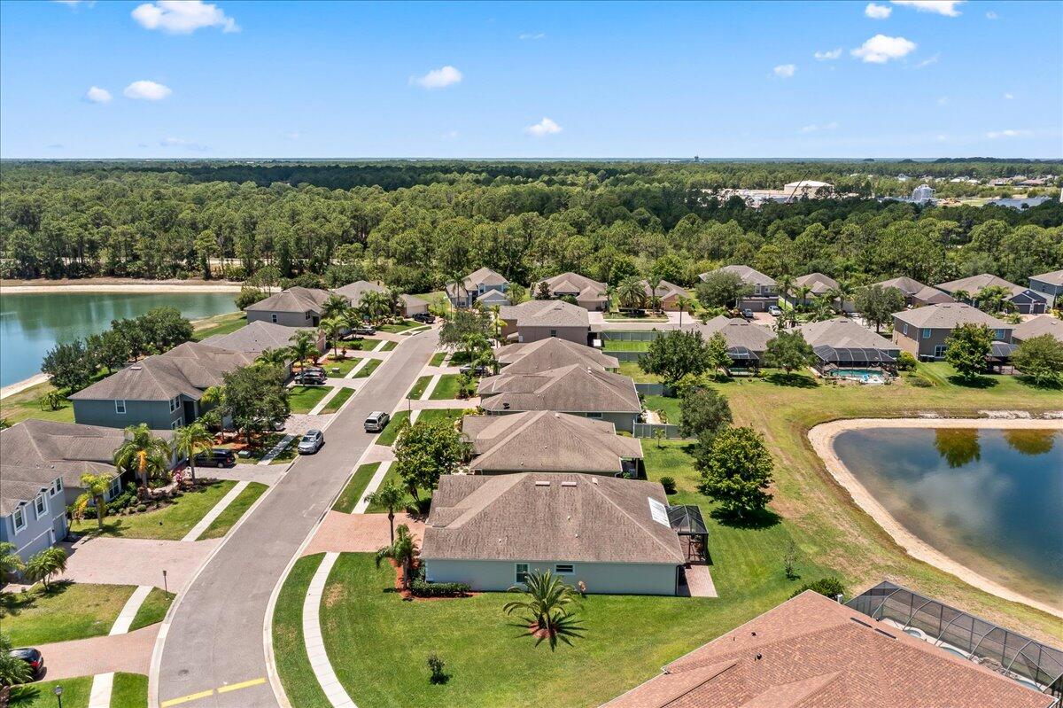 337 Abernathy Circle Palm Bay, FL 32909 - Photo 44 of 51 an aerial view of residential houses with outdoor space and swimming pool