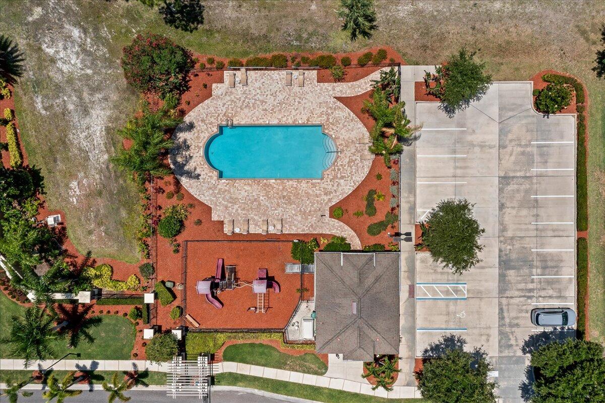337 Abernathy Circle Palm Bay, FL 32909 - Photo 51 of 51 an aerial view of a house with a swimming pool and outdoor seating