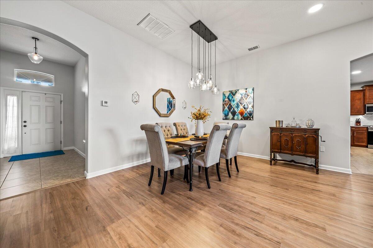 337 Abernathy Circle Palm Bay, FL 32909 - Photo 7 of 51 a view of a dining room with furniture and wooden floor