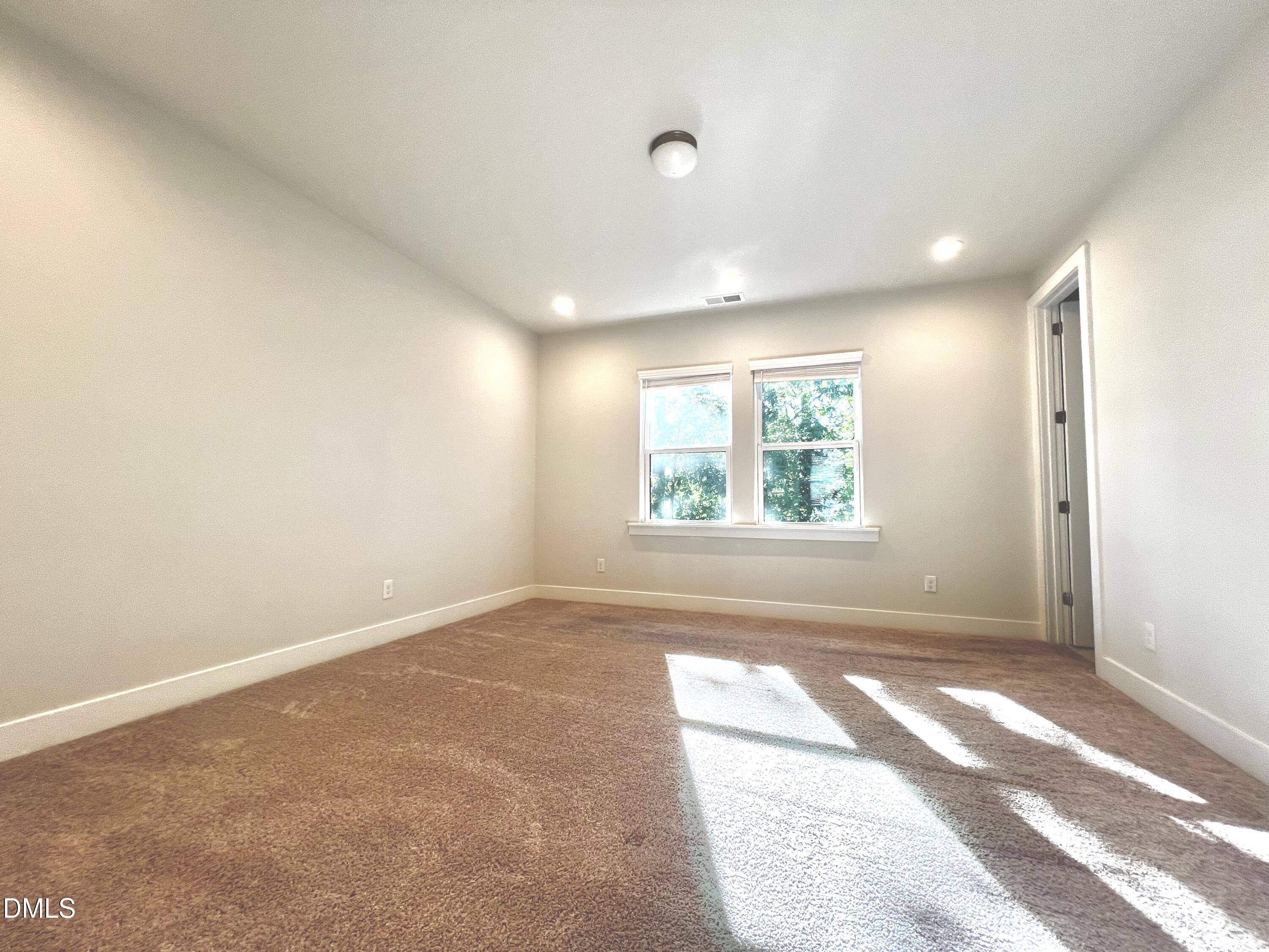 906 Waterside View Drive Raleigh, NC 27606 - Photo 9 of 9 an empty room with windows