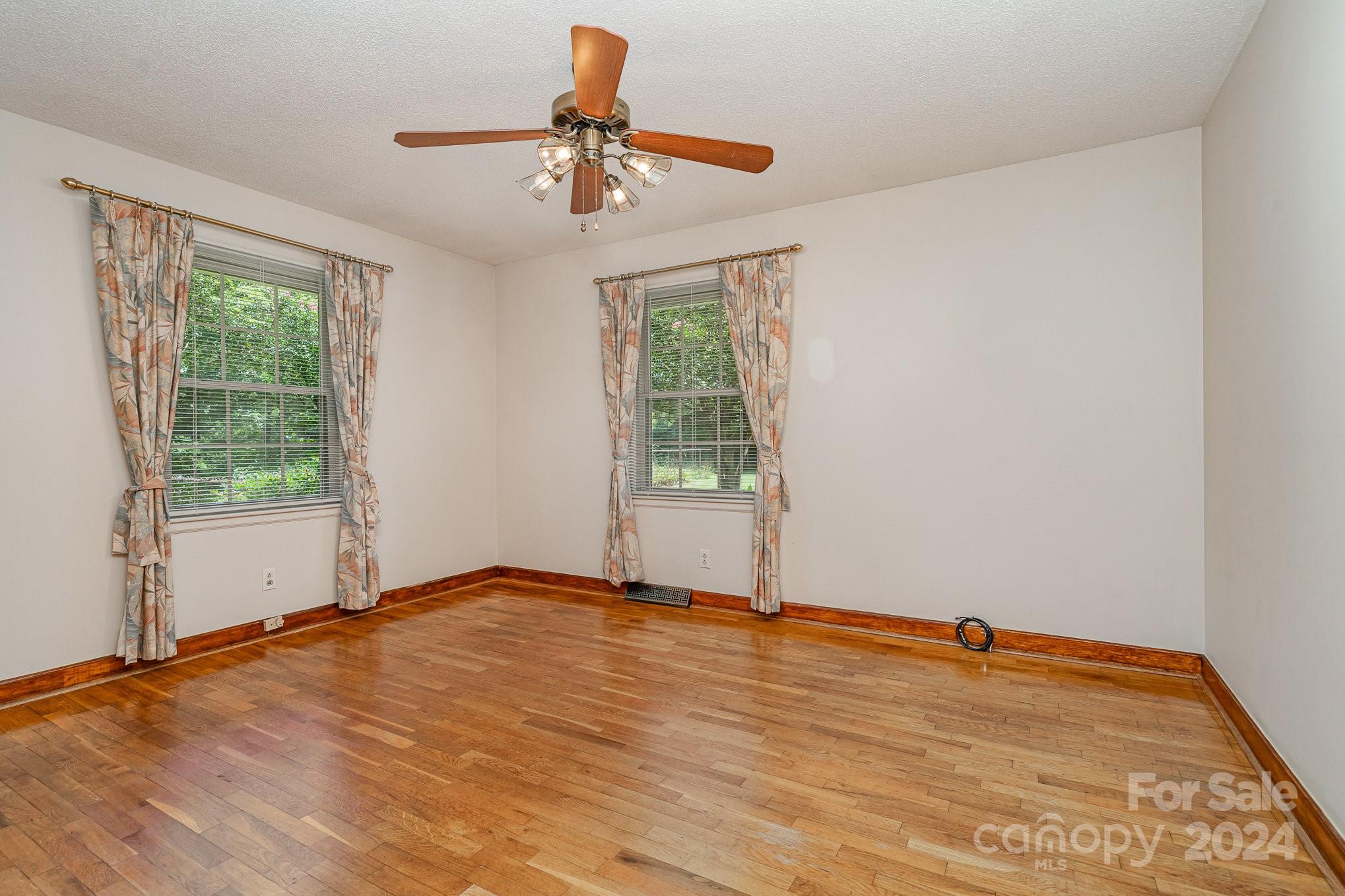 5124 Margaret Wallace Road Matthews, NC 28105 - Photo 12 of 26 a view of an empty room with a window