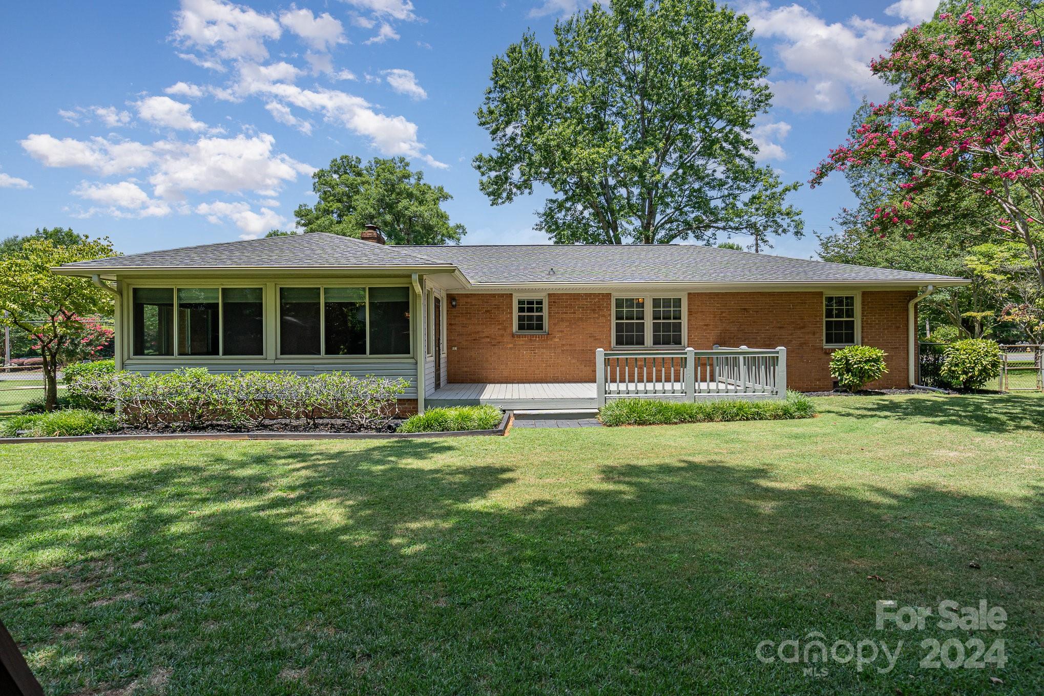 5124 Margaret Wallace Road Matthews, NC 28105 - Photo 23 of 26 front view of a house with a yard