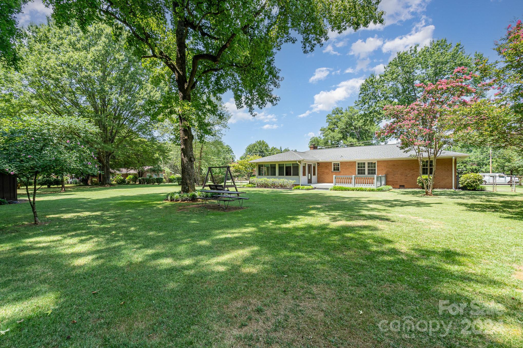5124 Margaret Wallace Road Matthews, NC 28105 - Photo 24 of 26 a front view of a house with a yard