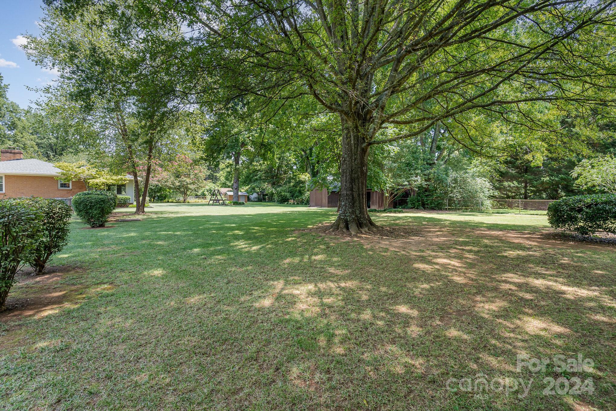 5124 Margaret Wallace Road Matthews, NC 28105 - Photo 25 of 26 a view of outdoor space with trees all around