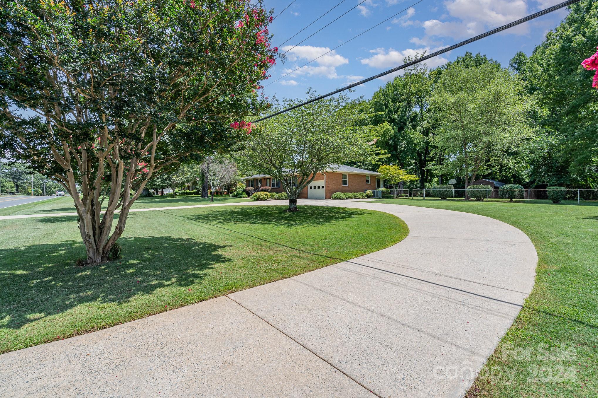 5124 Margaret Wallace Road Matthews, NC 28105 - Photo 3 of 26 a view of a garden with a slide