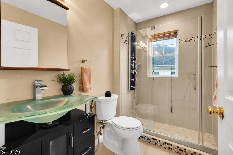 450 Vanderveer Road Bridgewater, NJ 08807 - Photo 30 of 44 a bathroom with a sink a toilet and shower