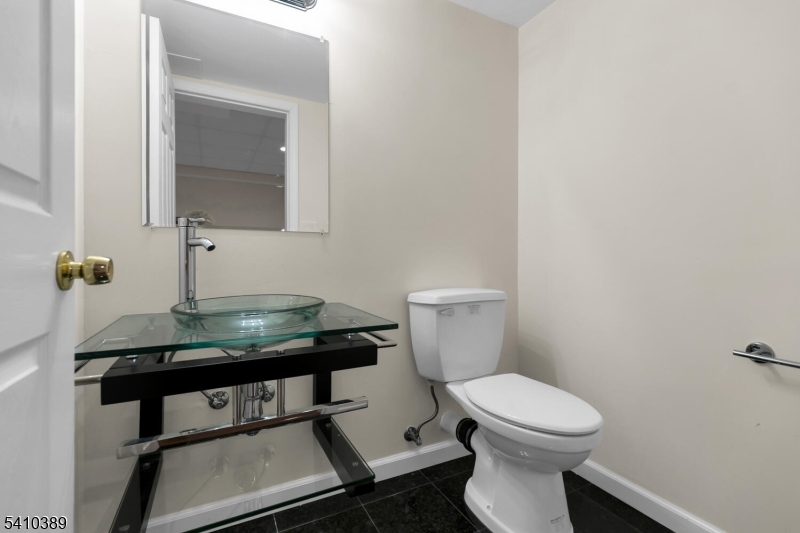 450 Vanderveer Road Bridgewater, NJ 08807 - Photo 37 of 44 a bathroom with a sink a toilet and mirror