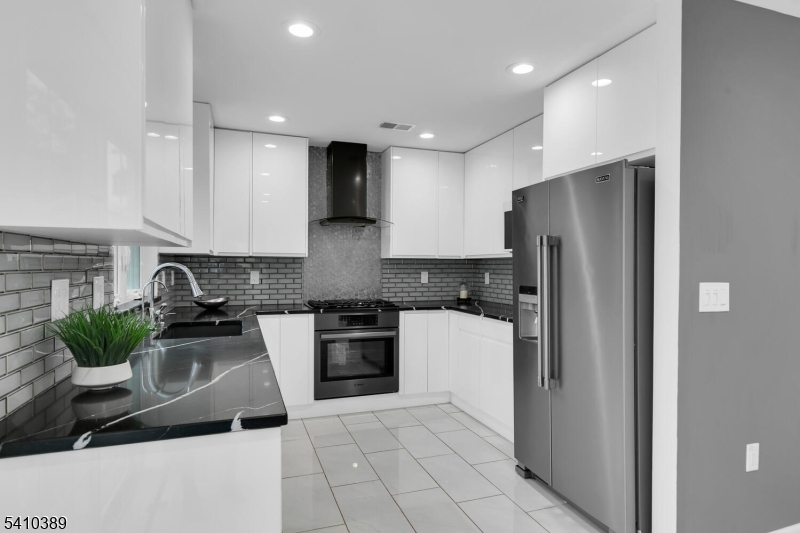 450 Vanderveer Road Bridgewater, NJ 08807 - Photo 8 of 44 a kitchen with stainless steel appliances granite countertop a refrigerator a stove and a sink