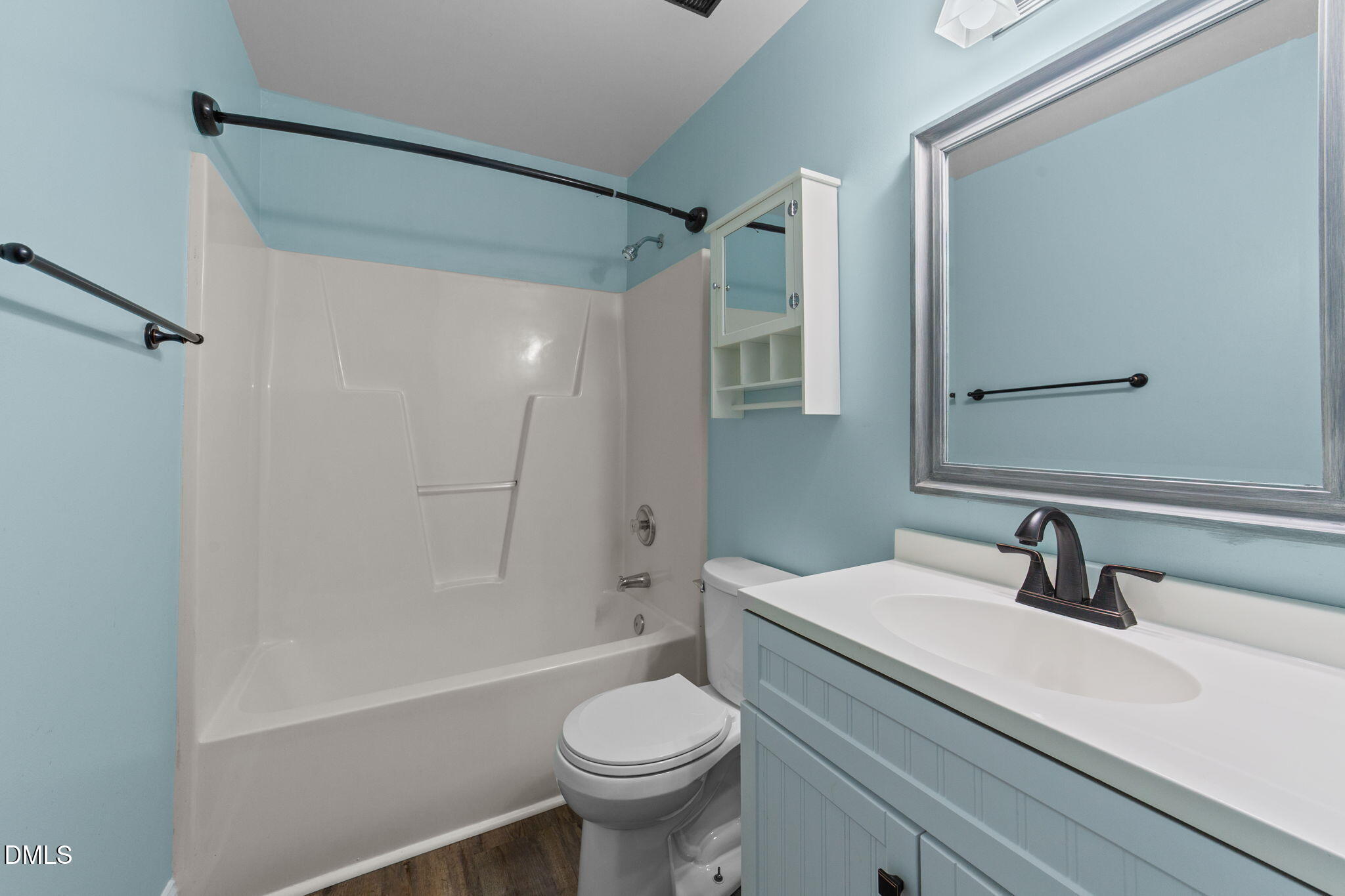 6820 Oviedo Drive Raleigh, NC 27603 - Photo 31 of 50 a bathroom with a sink a toilet and shower