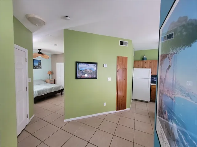 a bedroom with a bed and a view of bathroom