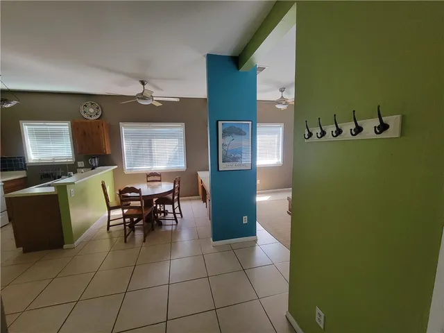 a view of a dining room with furniture and window