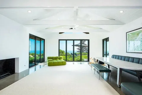 a spacious bedroom with a bed and a couch