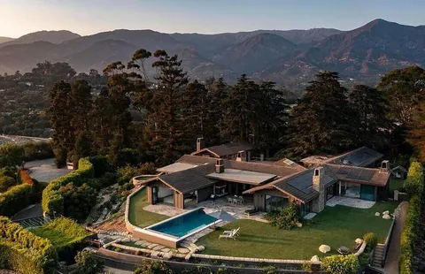 an aerial view of a house with a garden