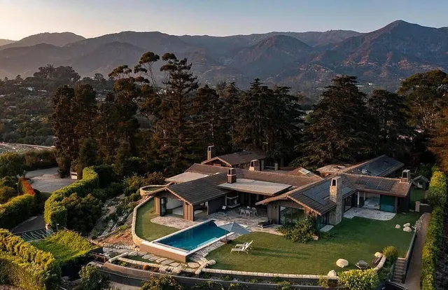 an aerial view of a house with a garden