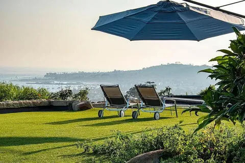 a backyard of a house with table and chairs