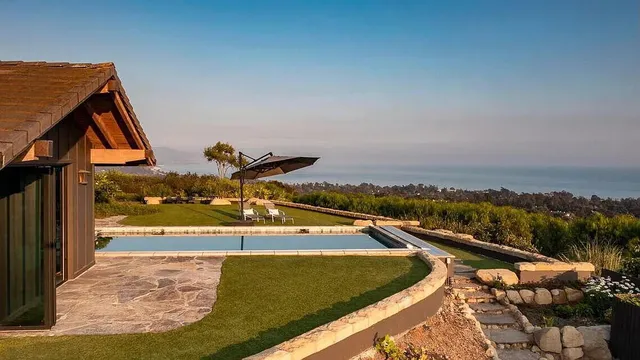 a view of a swimming pool with an ocean view