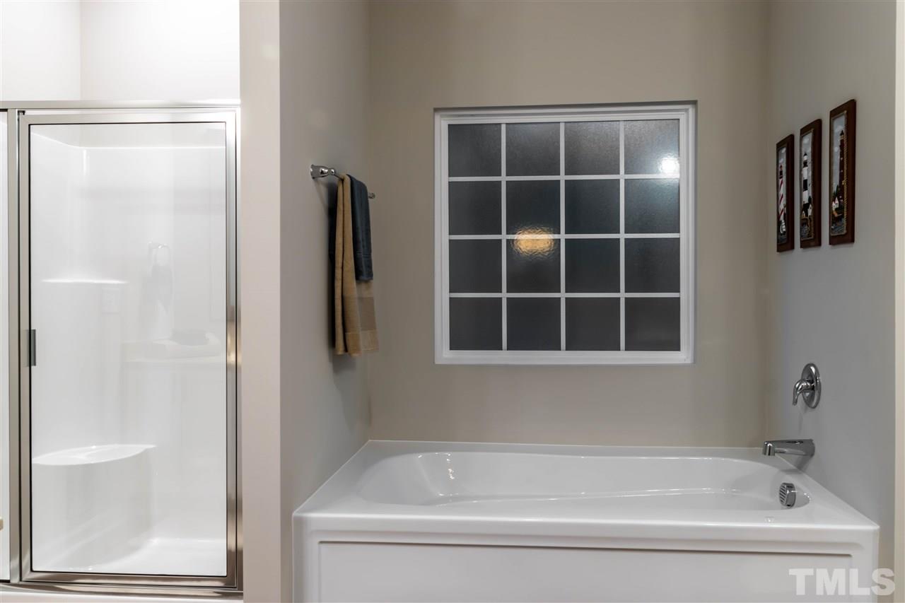 5317 B Fayetteville Road Durham, NC 27713 - Photo 11 of 30 Garden tub and standing shower with seat