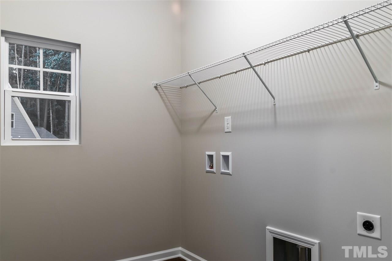 5317 B Fayetteville Road Durham, NC 27713 - Photo 16 of 30 Washer and Dryer room with rack