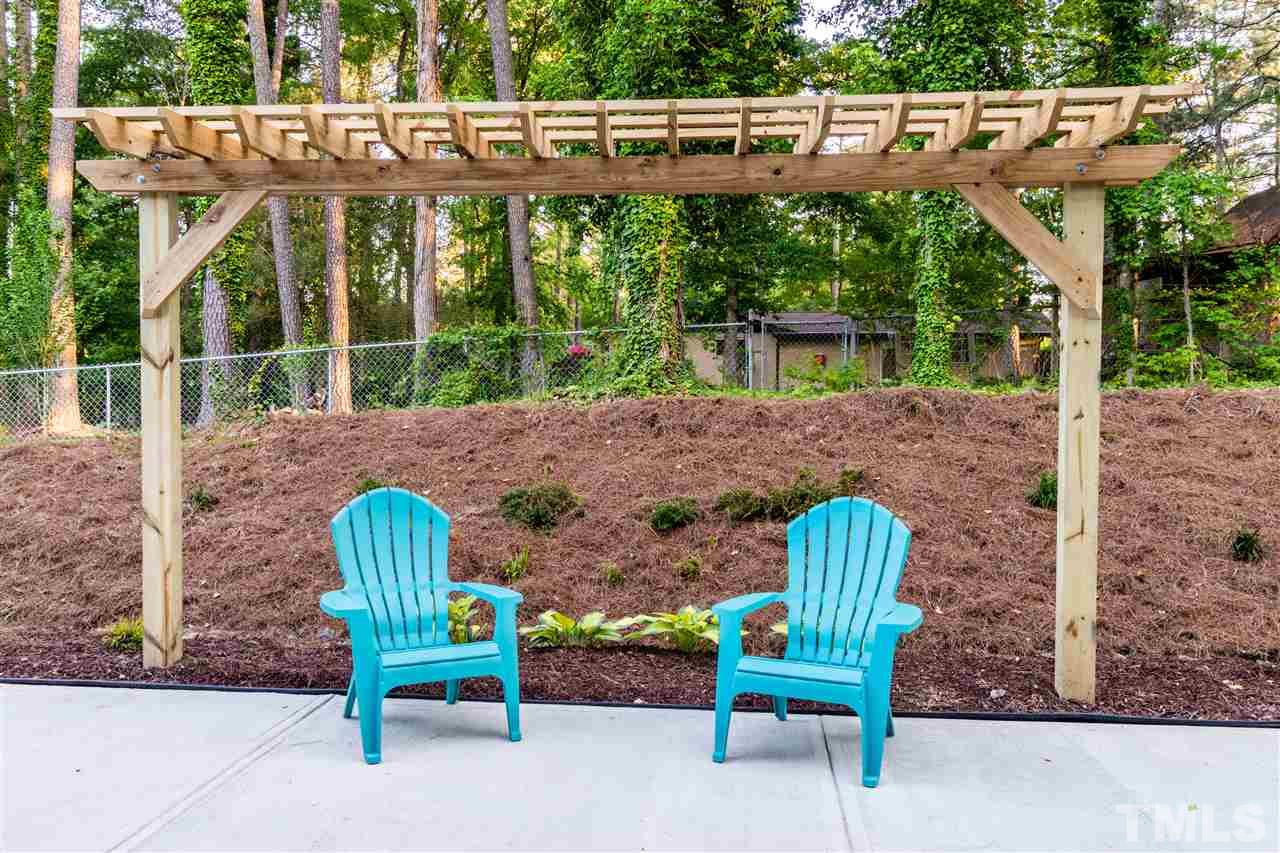 5317 B Fayetteville Road Durham, NC 27713 - Photo 27 of 30 Large concrete patio with arbor and nature view