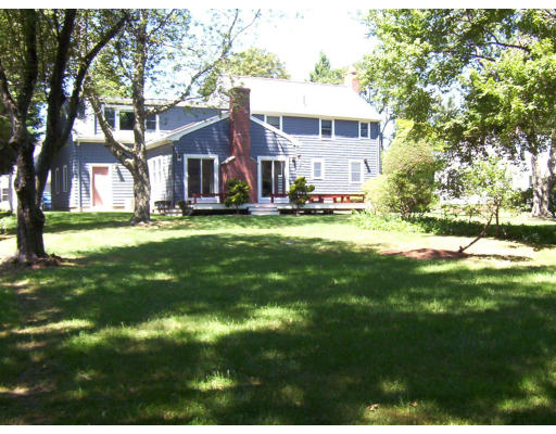 322 Lincoln Street Lexington, MA 02421 - Photo 2 of 9 a view of a house with a big yard plants and large trees