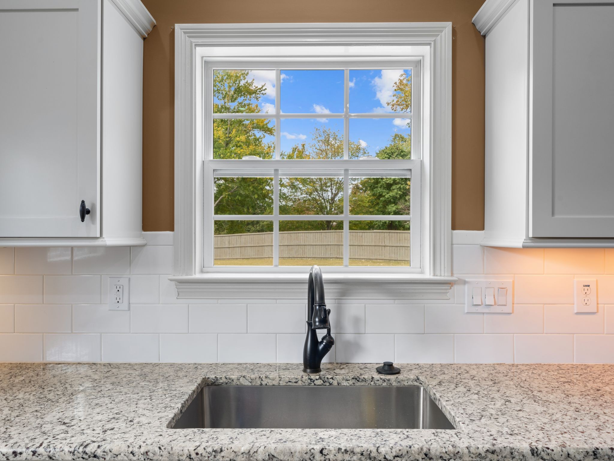 650 Dixie Bee Road Clarksville, TN 37043 - Photo 12 of 42 a kitchen with granite countertop a sink and a window