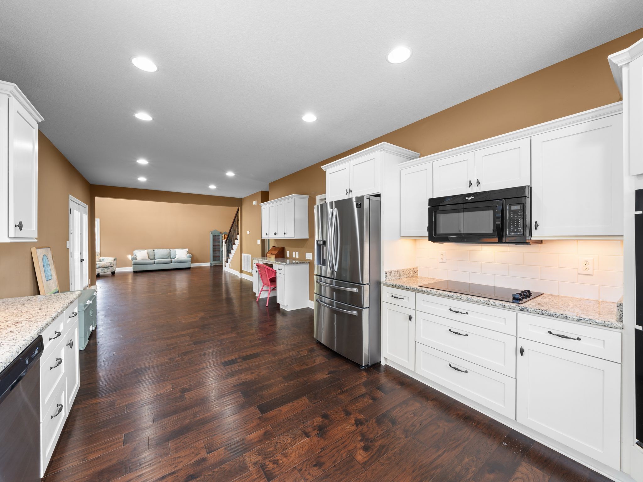 650 Dixie Bee Road Clarksville, TN 37043 - Photo 13 of 42 a open kitchen with stainless steel appliances granite countertop a refrigerator a sink dishwasher a oven with white cabinets and wooden floor