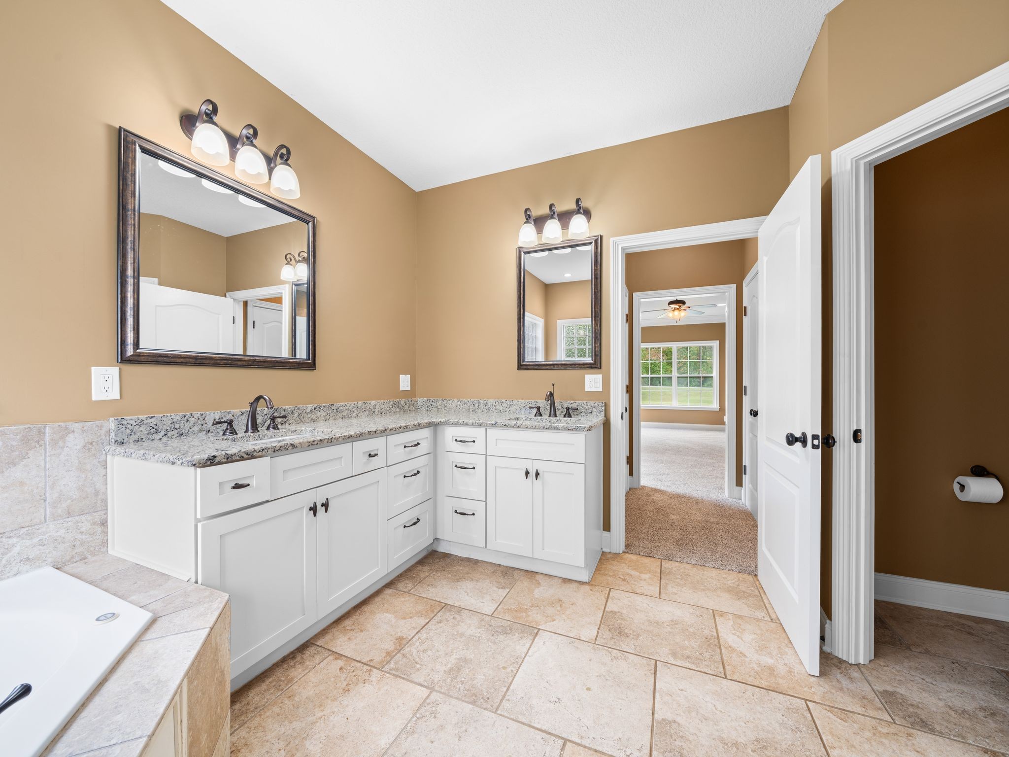 650 Dixie Bee Road Clarksville, TN 37043 - Photo 25 of 42 a spacious bathroom with a granite countertop sink mirror and