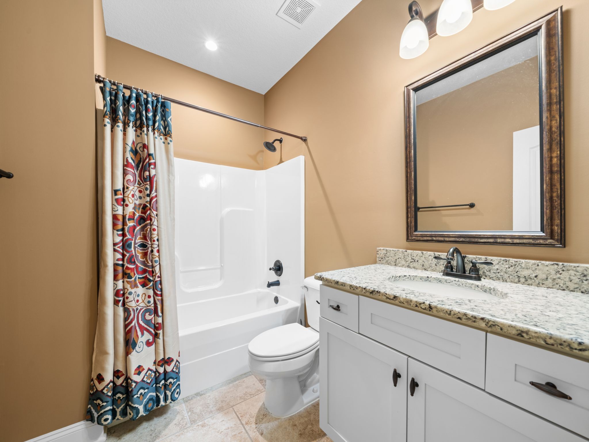 650 Dixie Bee Road Clarksville, TN 37043 - Photo 33 of 42 a bathroom with a granite countertop sink toilet mirror and a shower