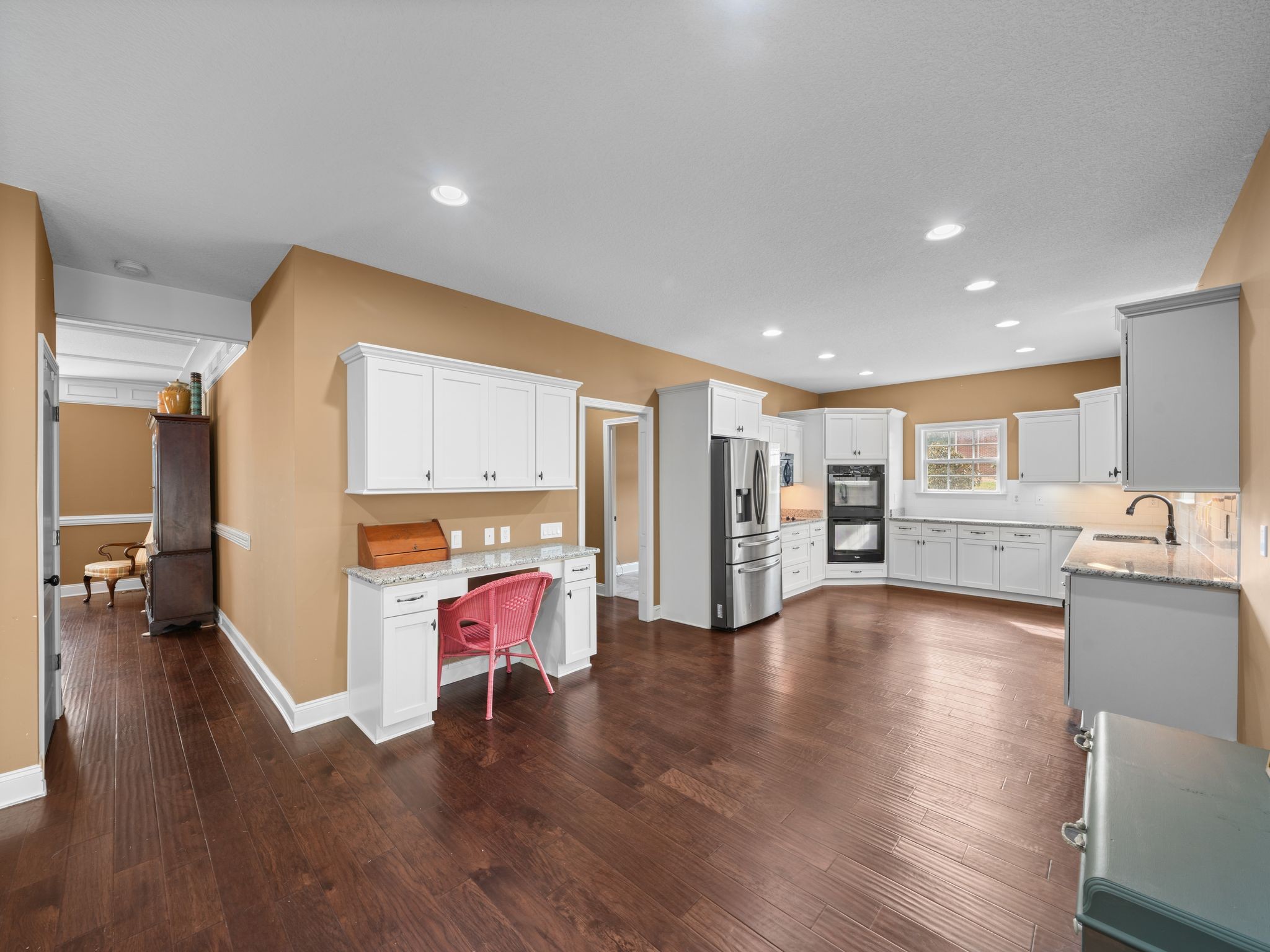 650 Dixie Bee Road Clarksville, TN 37043 - Photo 10 of 42 a view of kitchen with stainless steel appliances kitchen island wooden floors and living room view