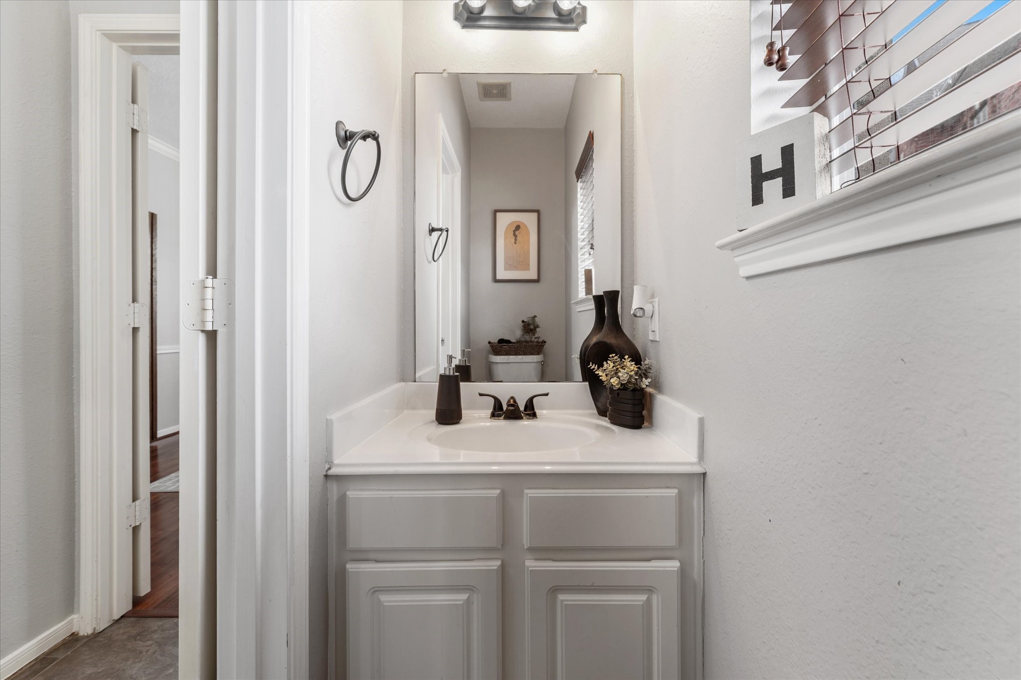 4318 Raintree Court Pasadena, TX 77505 - Photo 13 of 36 a bathroom with a sink and mirror