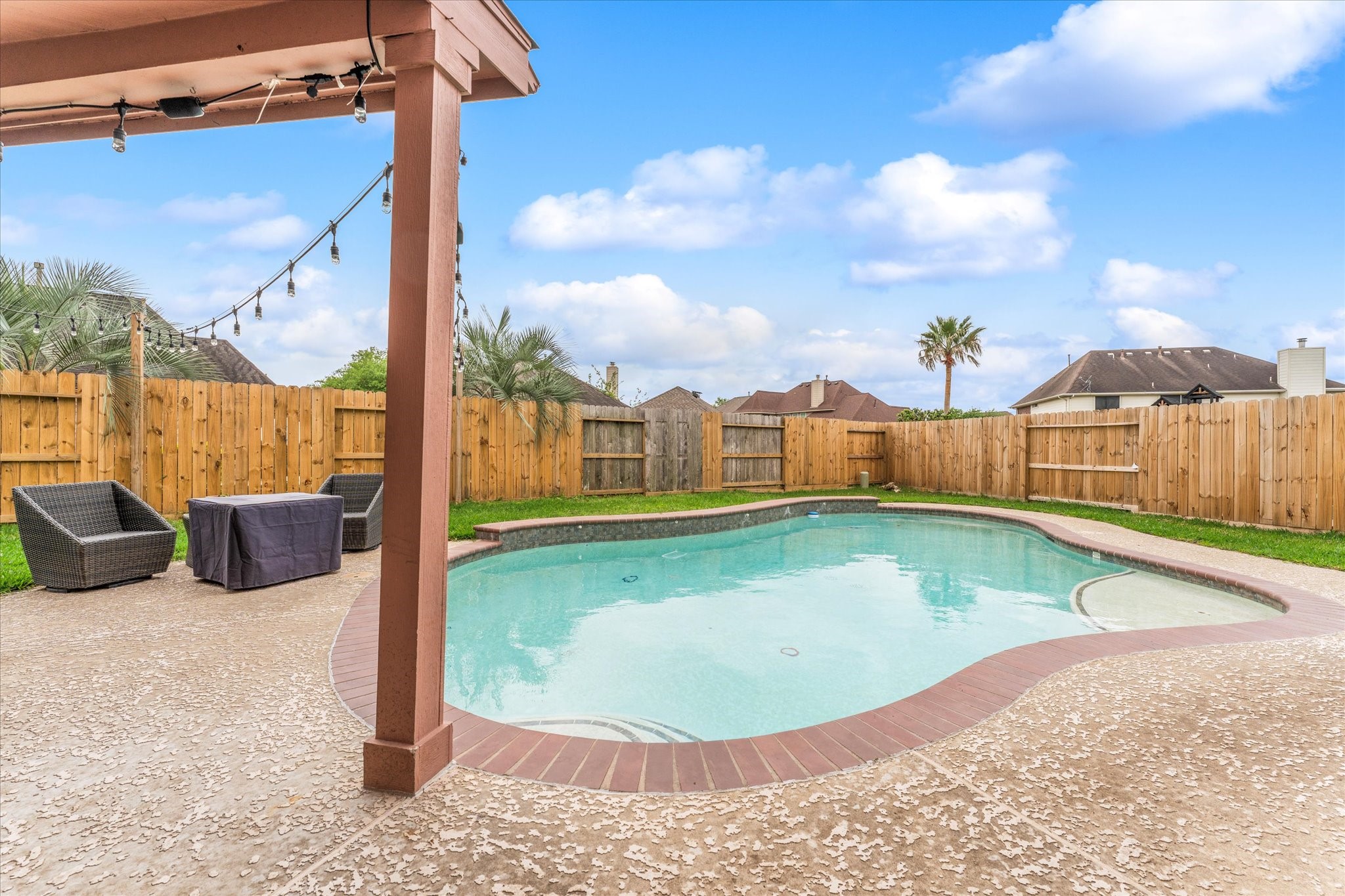 4318 Raintree Court Pasadena, TX 77505 - Photo 33 of 36 a view of a swimming pool with a patio