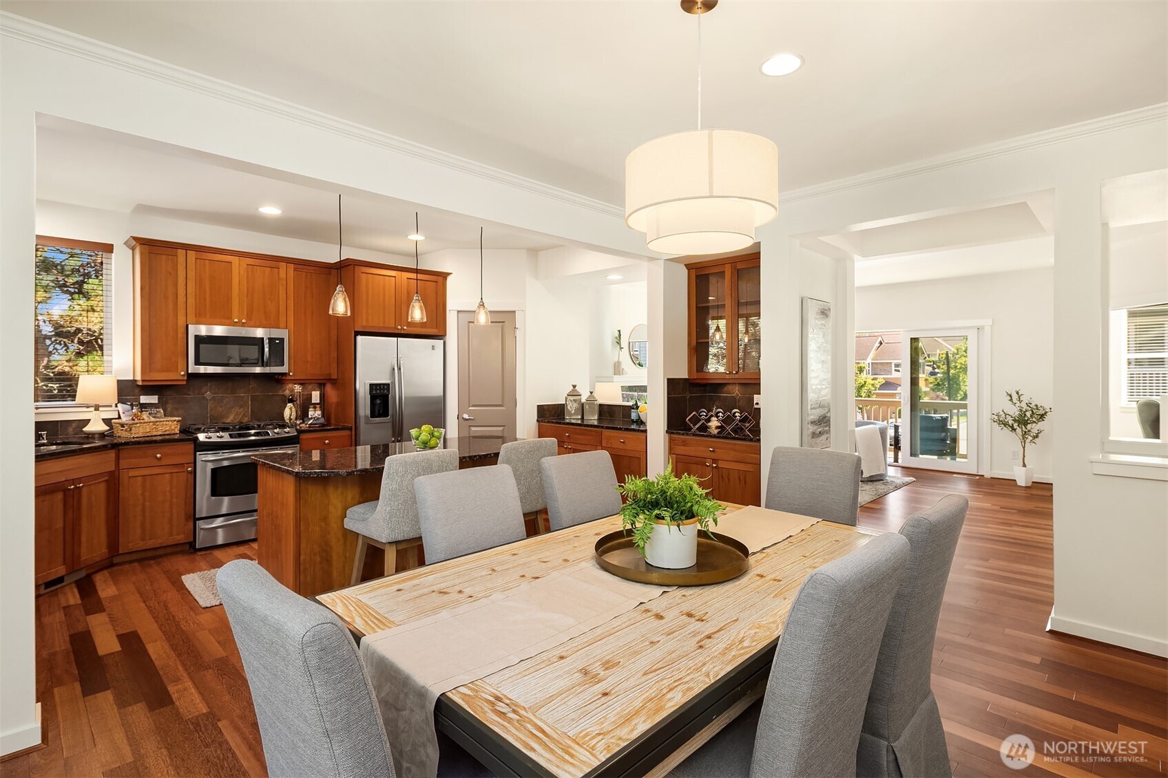 597 Alpine Ridge Place Northwest Issaquah, WA 98027 - Photo 12 of 32 a view of a dining room with furniture window and wooden floor