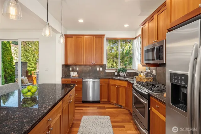 a bathroom with a sink mirror and toilet