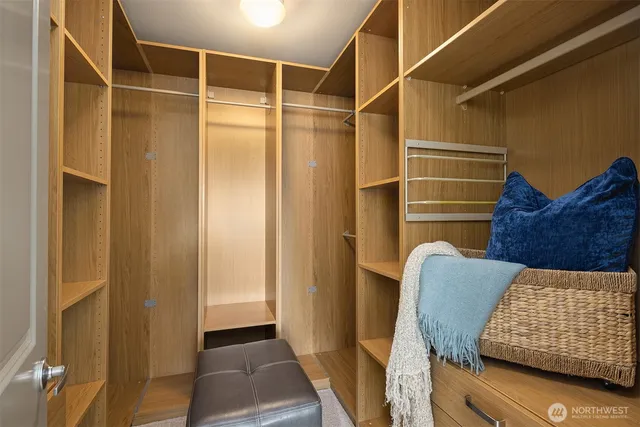 a bedroom with bed and a window