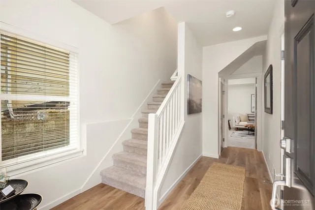 a living room with furniture and a rug
