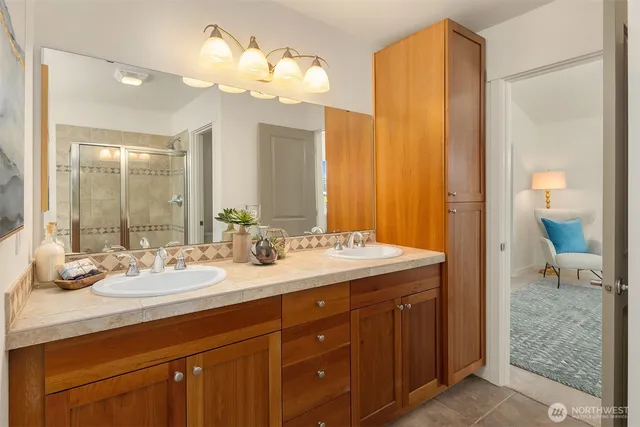 a balcony with wooden floor and outdoor seating