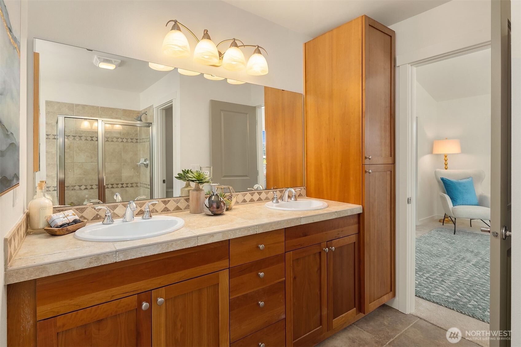 597 Alpine Ridge Place Northwest Issaquah, WA 98027 - Photo 24 of 32 a bathroom with a granite countertop sink and a mirror