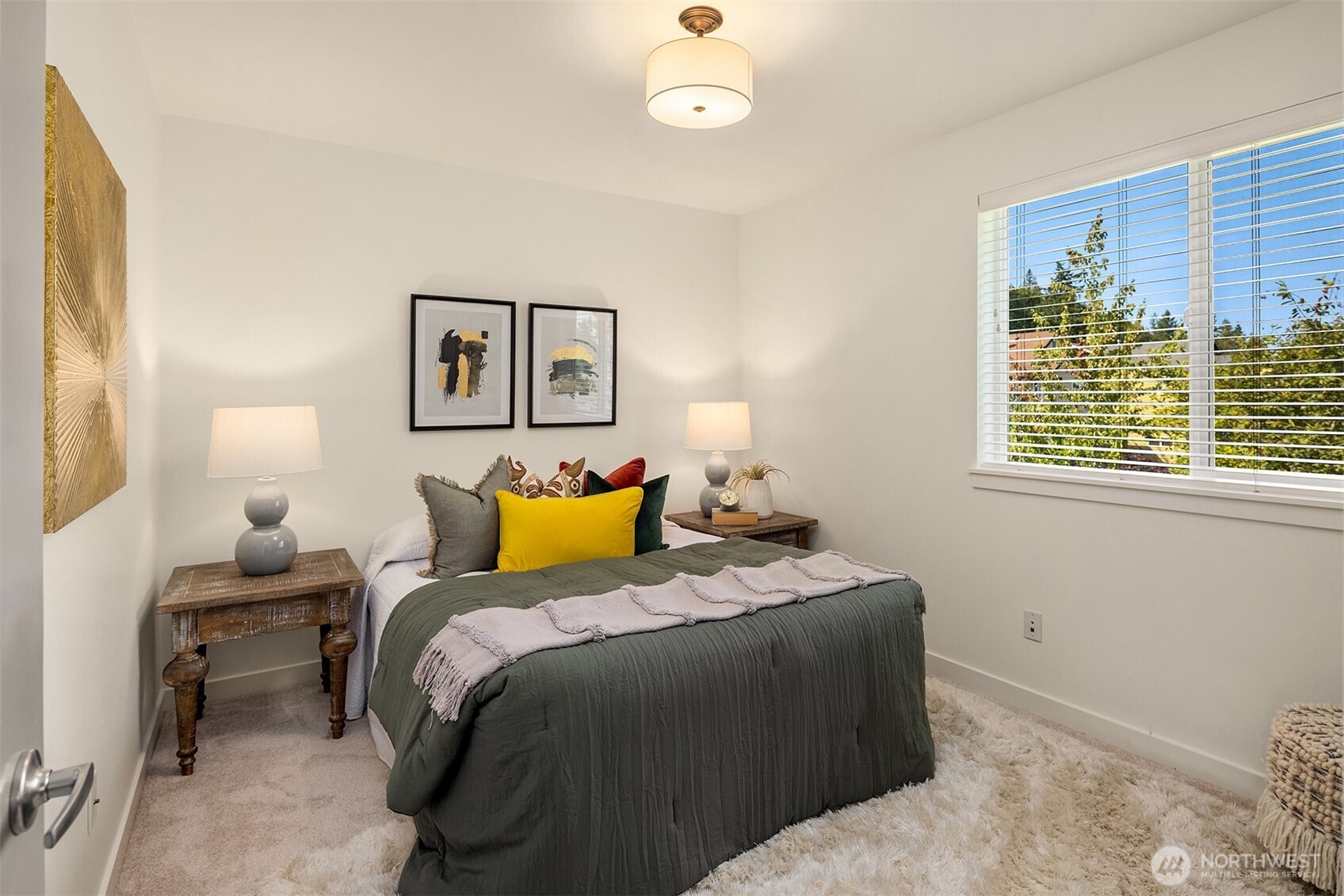 597 Alpine Ridge Place Northwest Issaquah, WA 98027 - Photo 25 of 32 a bedroom with bed and a window