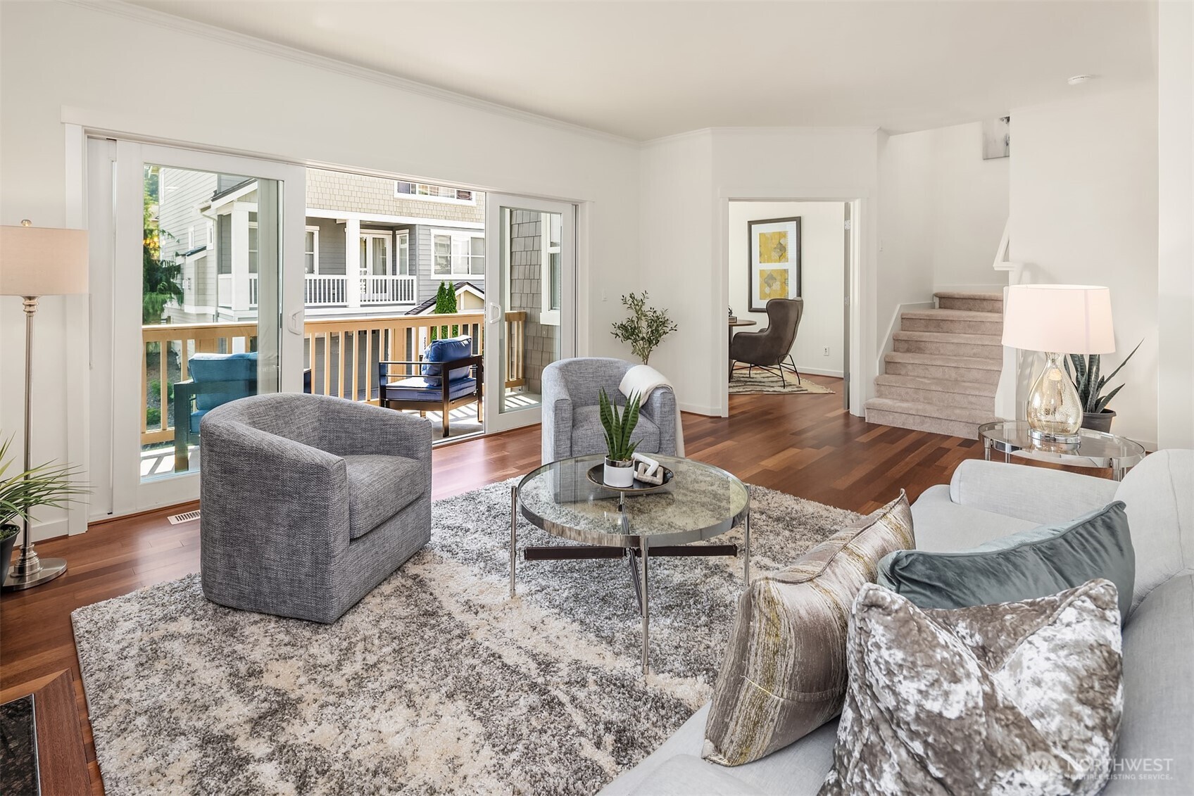 597 Alpine Ridge Place Northwest Issaquah, WA 98027 - Photo 7 of 32 a living room with furniture and wooden floor