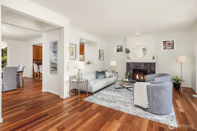 a view of a dining room with furniture window and wooden floor
