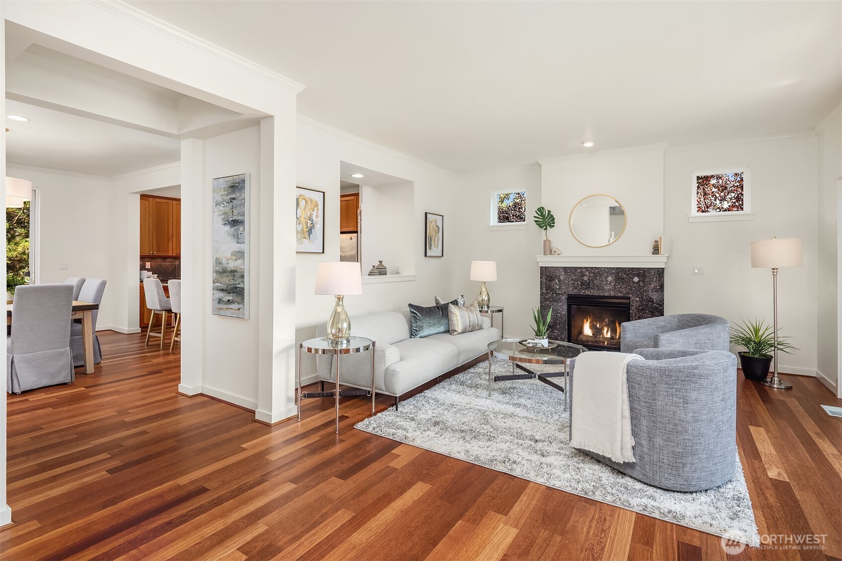 597 Alpine Ridge Place Northwest Issaquah, WA 98027 - Photo 10 of 32 a living room with furniture a fireplace and a table