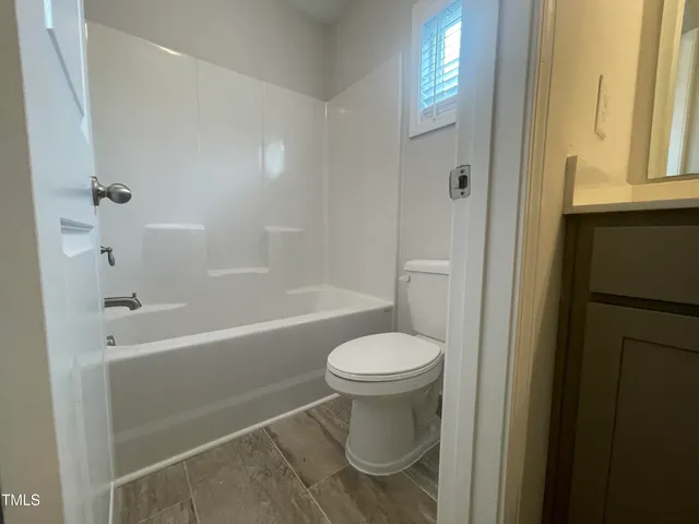 an empty room with closet area