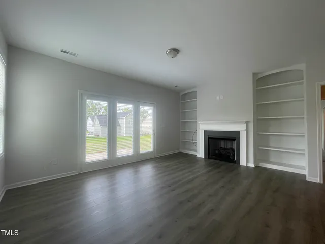 a view of a kitchen cabinets and a wooden floor